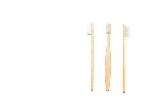 Bamboo toothbrush on an isolated background. Tooth cleaning. Article about choosing a toothbrush. Article about dental care. Bath accessories. Collection on vacation. Natural material. Eco-products. . Concern for the environment. Copy space.