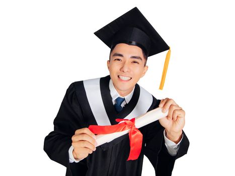 Excited young man in  black graduation gown and cap  showing diploma