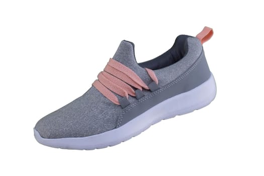 Gray sneaker with orange laces. Sport shoes on white background