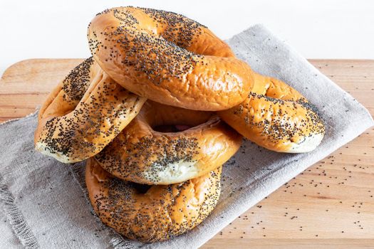 Bagels with poppy seeds on a napkin