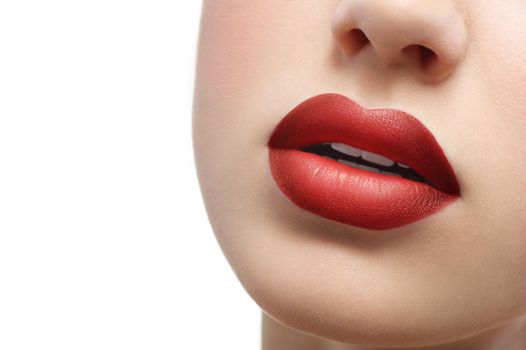 Close up shot of plump sexy female lips covered with lipstick