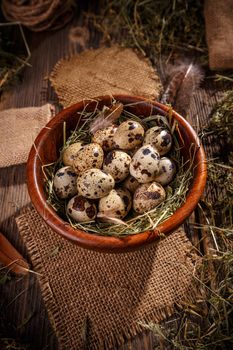 Wooden bowl of quail eggs