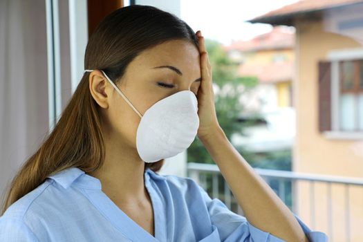 COVID-19 Pandemic Coronavirus Sick woman home isolation auto quarantine wearing face mask for spreading of disease virus SARS-CoV-2. Girl isolation mask on face for Coronavirus Disease 2019.