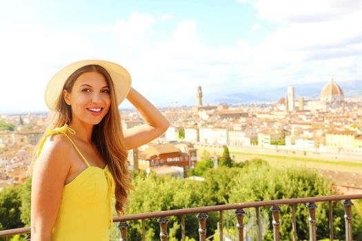 Happy cheerful tourist girl in Florence, Italy. Portrait of young woman visiting Italy.