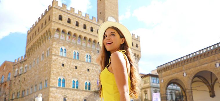 Beautiful tourist girl discovering Florence, Italy. Panoramic banner view of young woman in her holidays in Europe.