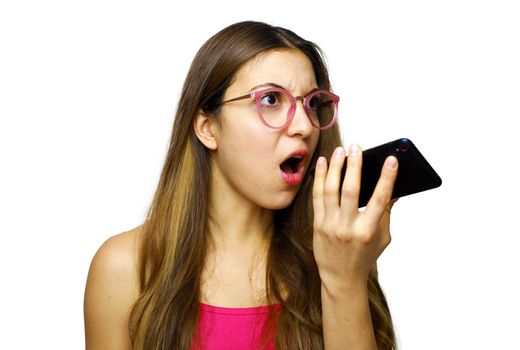 Angry girl using speakerphone for call with her boyfriend on smart phone