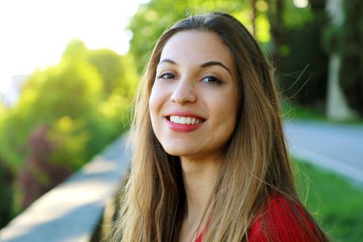 Beautiful smiling woman in the park