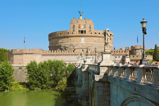 ROME, ITALY - SEPTEMBER 17, 2019: tourists on bridge and Castel Sant Angelo on the background, Rome, Italy.