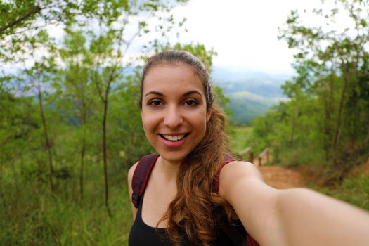 Young hiker woman take self portrait in brazilian forest