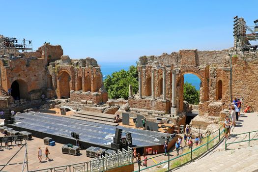 TAORMINA, ITALY - JUNE 20, 2019: Ruins of the Ancient Greek Theater in Taormina, Sicily 