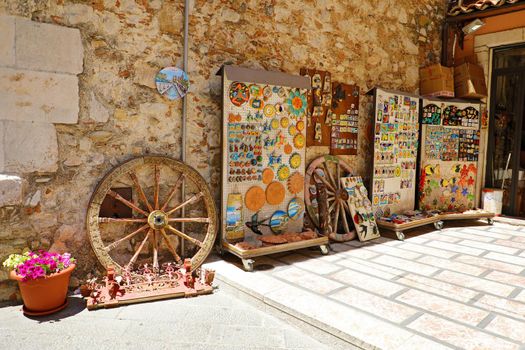 TAORMINA, ITALY - JUNE 20, 2019: cozy street with souvenirs in Taormina, Sicily