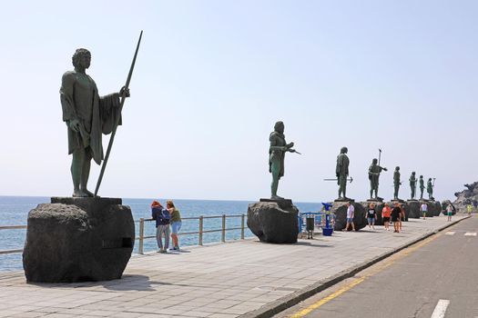TENERIFE, SPAIN - JUNE 1, 2019: Guanche statues on waterfront of Candelaria village, Tenerife, Spain