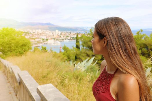 Meditative young woman looking at Split on Dalmatian Coast, Croatia, Europe