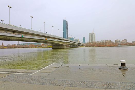 VIENNA, AUSTRIA - JANUARY 9, 2019: Danube City or Donaustadt is district of Vienna, Austria. Reichsbrücke bridge with Danube City, a modern quarter with skyscrapers and business centres 