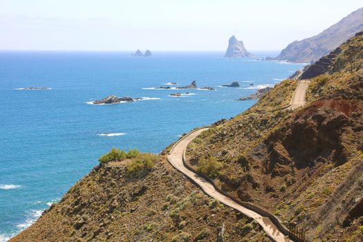 Hard difficult road on Tenerife Island with beautiful seascape.