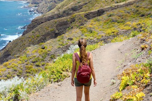 Female hiker descent the pathway with spectacular landscape of Tenerife, Canary Islands