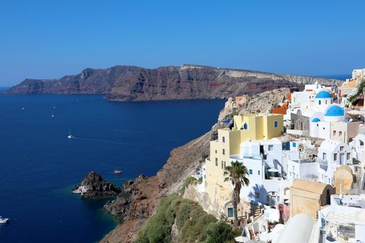 Santorini: Oia traditional greek white village with blue domes of churches, Greece
