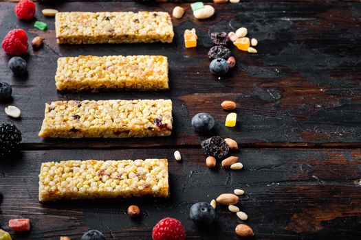 Superfood breakfast bars with oats nuts and berries with copy space, on wooden table