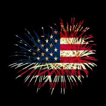 Concept of celebrating Independence Day in United States of America. USA national flag with fireworks backdrop for 4th of July.