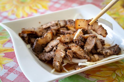 Delicious Taiwanese salted pork food with onion in restaurant.