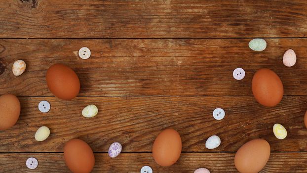 Eggs on a wooden rustic background with copy space for text.
