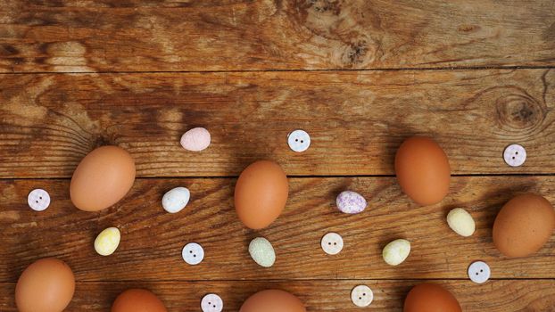 Eggs on a wooden rustic background with copy space for text.