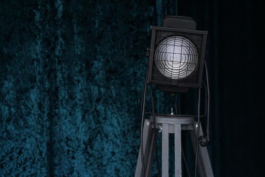 Photo studio lighting equipment on black and blue background
