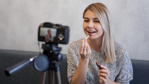 A beauty blogger or video blogger tells and shows subscribers how to do makeup