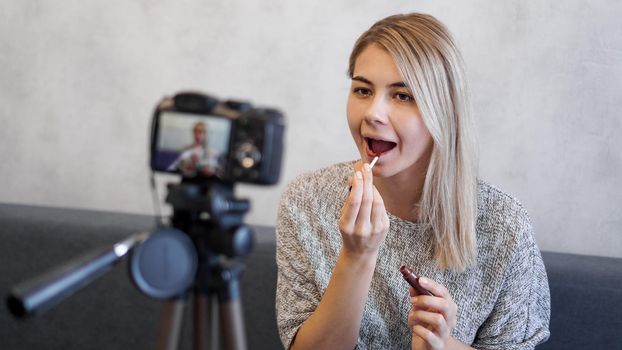 A beauty blogger or video blogger tells and shows subscribers how to do makeup