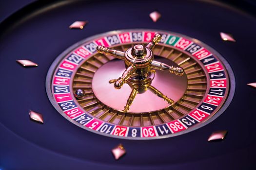 Roulette wheel in motion in a casino background 