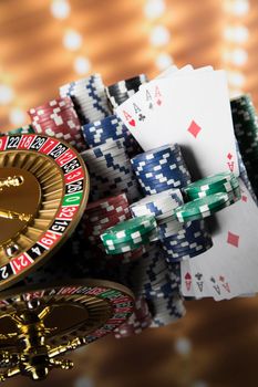 Poker Chips, Roulette wheel in motion, casino background 