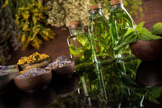 Oil and Natural medicine, wooden table background