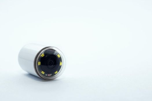 Capsule with camera for capsular endoscopy on white background