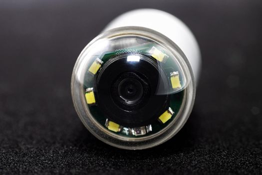 Capsule with camera for capsular endoscopy on black background