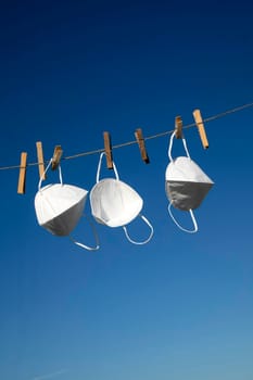 Coronavirus protection masks hung out to dry 