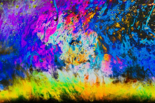 Paint dissolve swirling in water forming colorful background