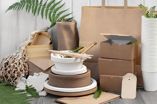 Eco friendly packaging and dishes made from natural recyclable materials. Environmental protection and waste reduction concept