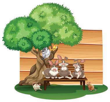 Mix animals sitting under a tree