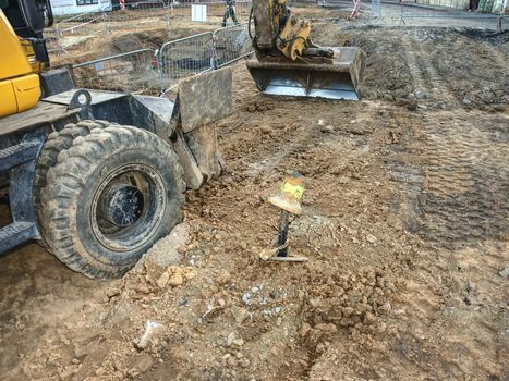 Potable water pipes rebuilding. Old excavator excavation work 