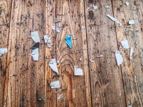 Scraps of paper on a wooden wall or  old wooden fence. 