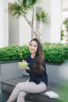 Beautiful healthy woman eating salad, Dieting Concept. Healthy Lifestyle.