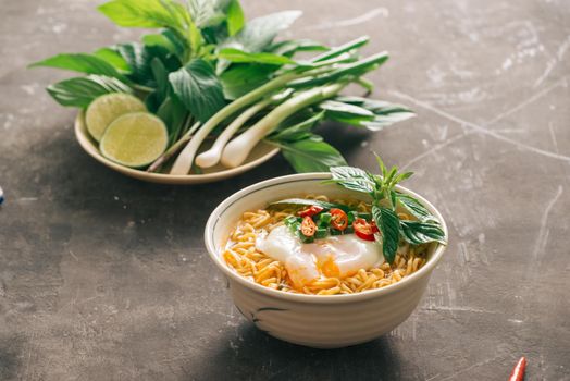 Instant noodles soup put egg and vegetables