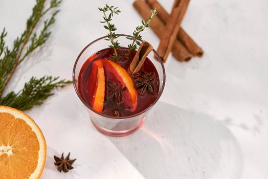 Cooking oranges in red wine with spices