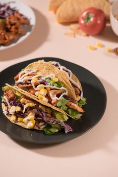 Traditional mexican taco with meat and vegetables. Latin american food.