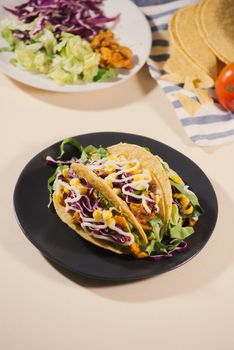 Traditional mexican taco with meat and vegetables. Latin american food.