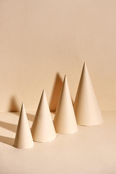 Creative Christmas tree made of paper on beige background