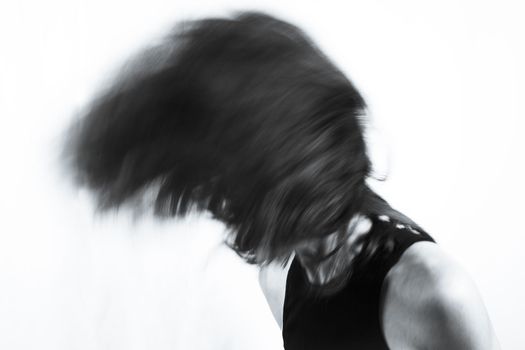 Motion blur portrait of woman over 40