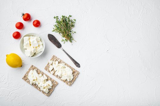 Crisp bread sandwich, square format, on white stone table background, top view flat lay, with copy space for text