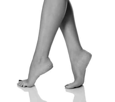 Female feet on white background