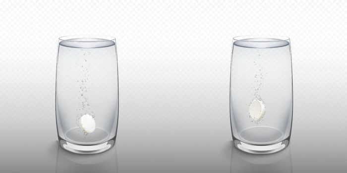 Effervescent soluble tablet in water glass